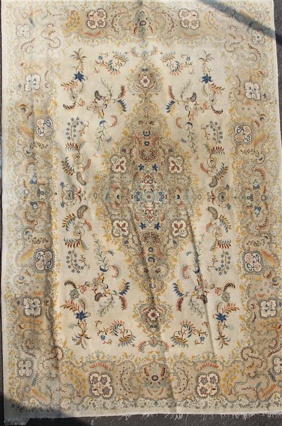 A Kashan cream ground five colour carpet, 15ft by 10ft 8in.